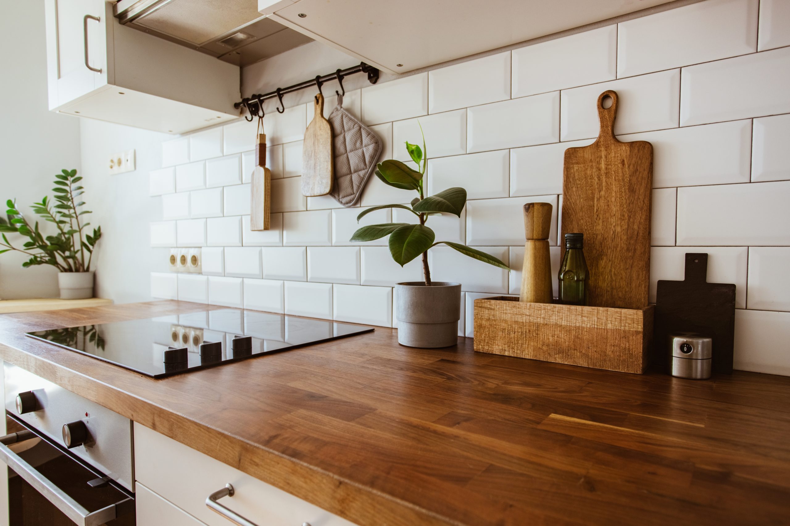 A ceramic bathroom floor with a white grout. The floor is smooth and has a glossy finish. It is a modern and stylish look that is perfect for any bathroom.