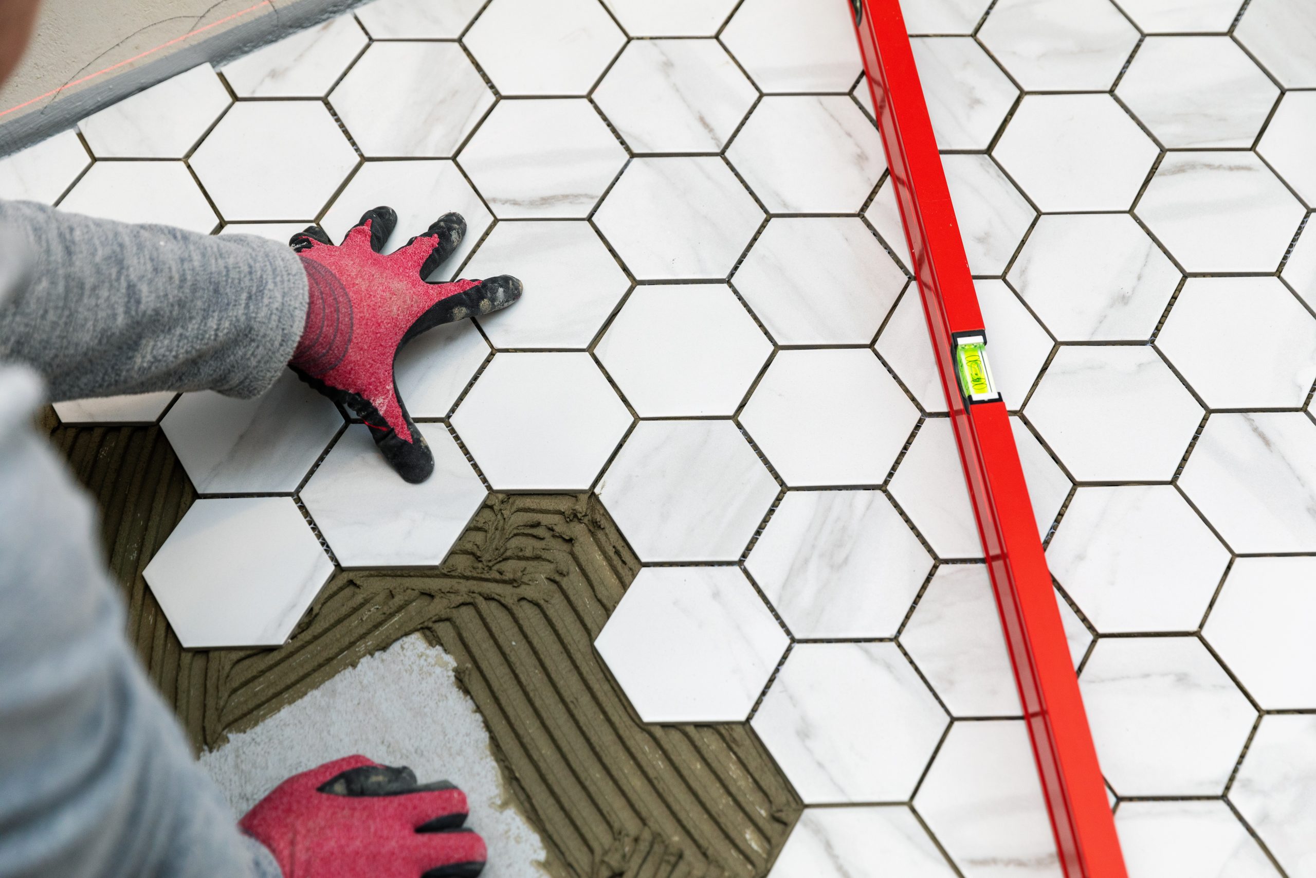  A close-up of engineered flooring. The flooring is made of a thin layer of hardwood veneer bonded to a plywood subfloor. The hardwood veneer gives the flooring a natural look and feel, while the plywood subfloor provides strength and durability.