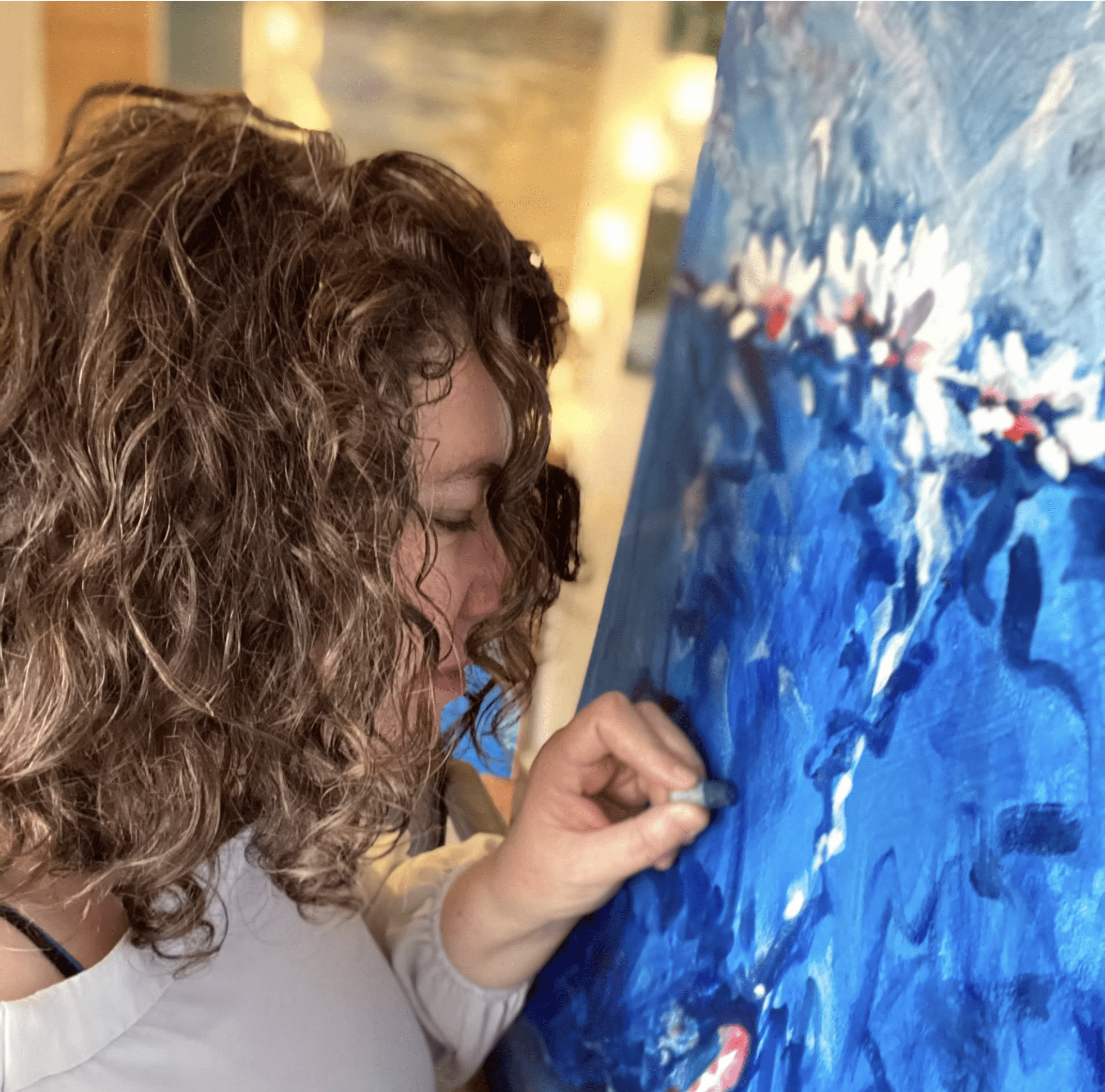 Mural artist Kirsteen Lyons-Benson painting in Edinburgh