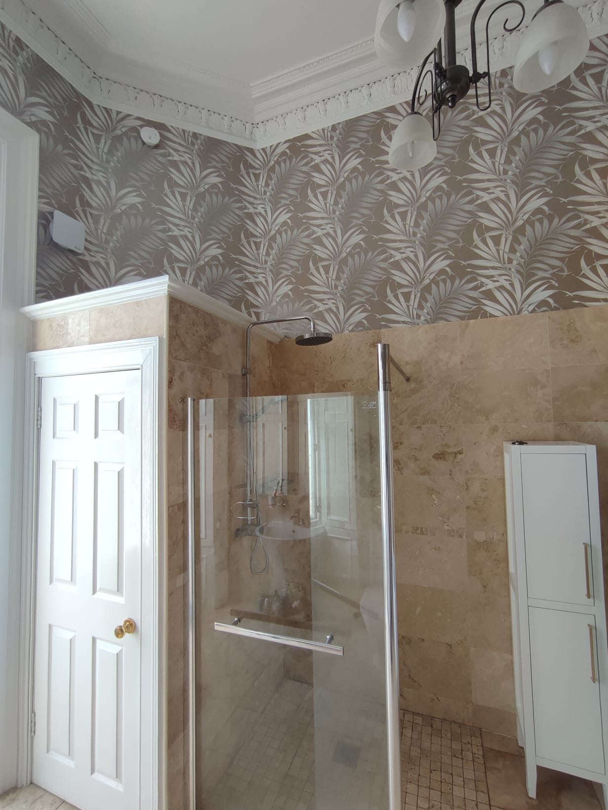 Botanical wallpaper detail in an Edinburgh bathroom