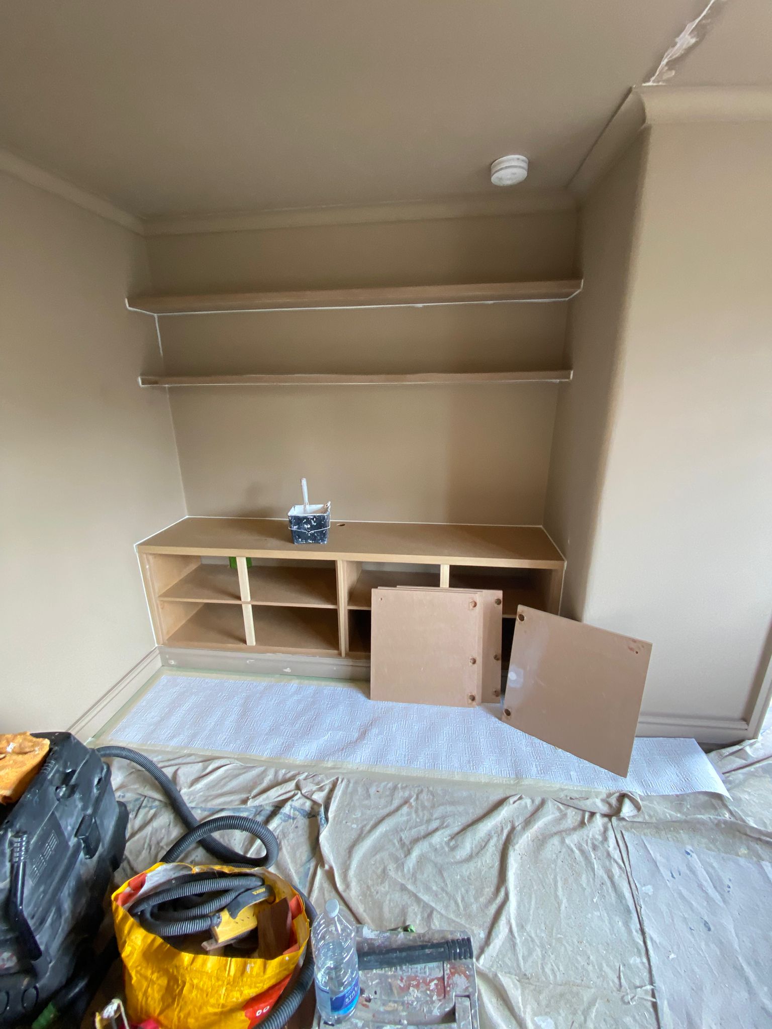 Painted living room cabinetry and shelving after decorating in Edinburgh